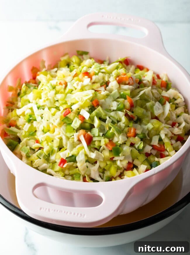 Chopped fresh veggies in a colander.