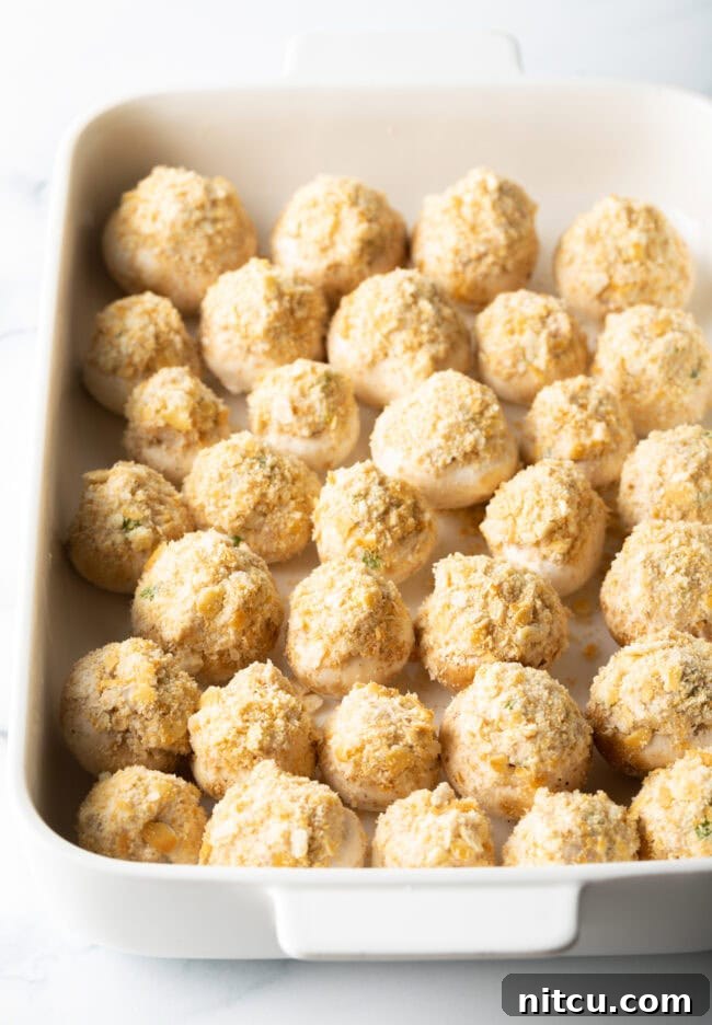 Breaded seafood stuffed mushrooms with ritz crackers - ready to bake.