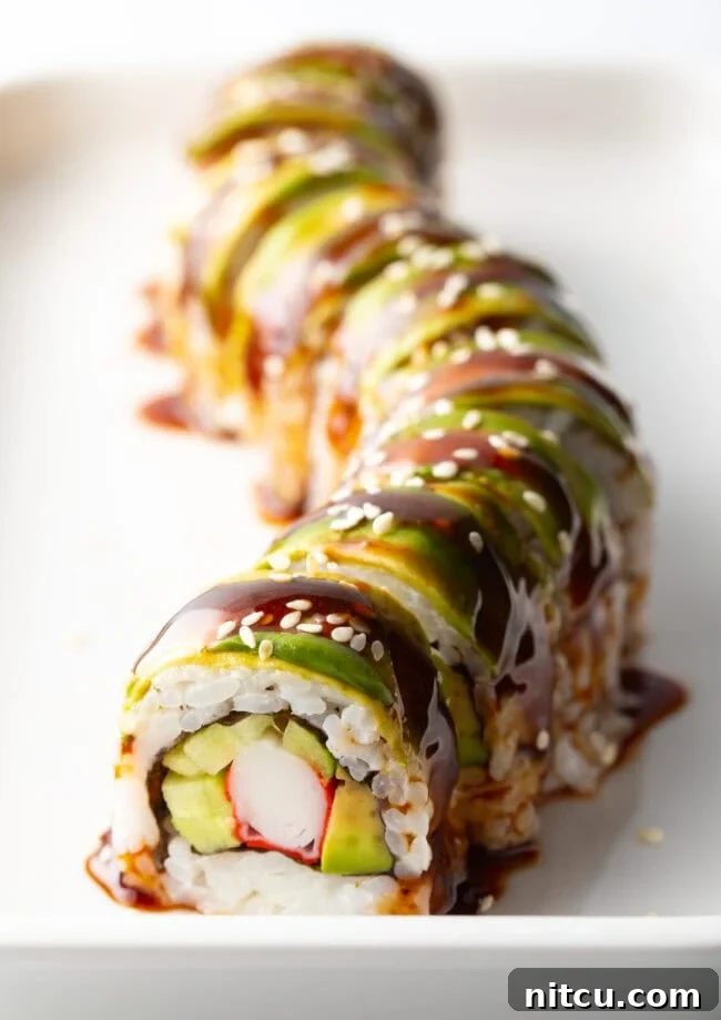 Sushi roll on a white rectangle plate, drizzled with eel sauce made with 3 ingredients.