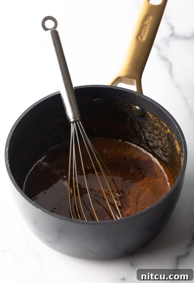 Black sauce pot with eel sauce ingredients.