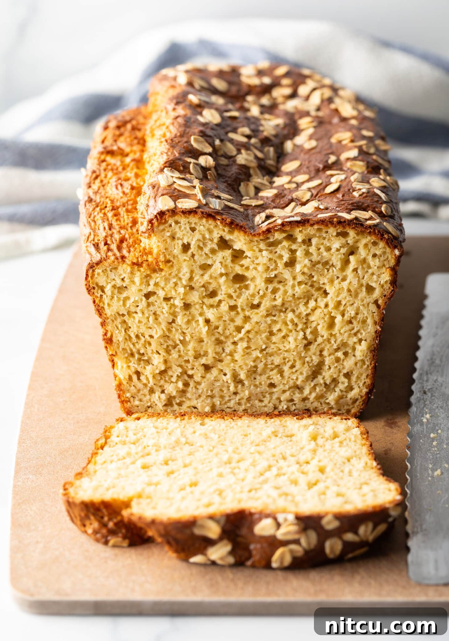 Loaf of bread, one piece sliced to show inside of the loaf.