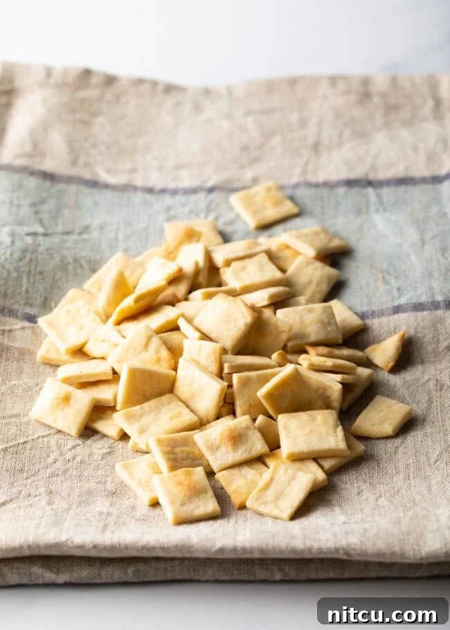A pile of freshly baked communion bread, cut into small squares.