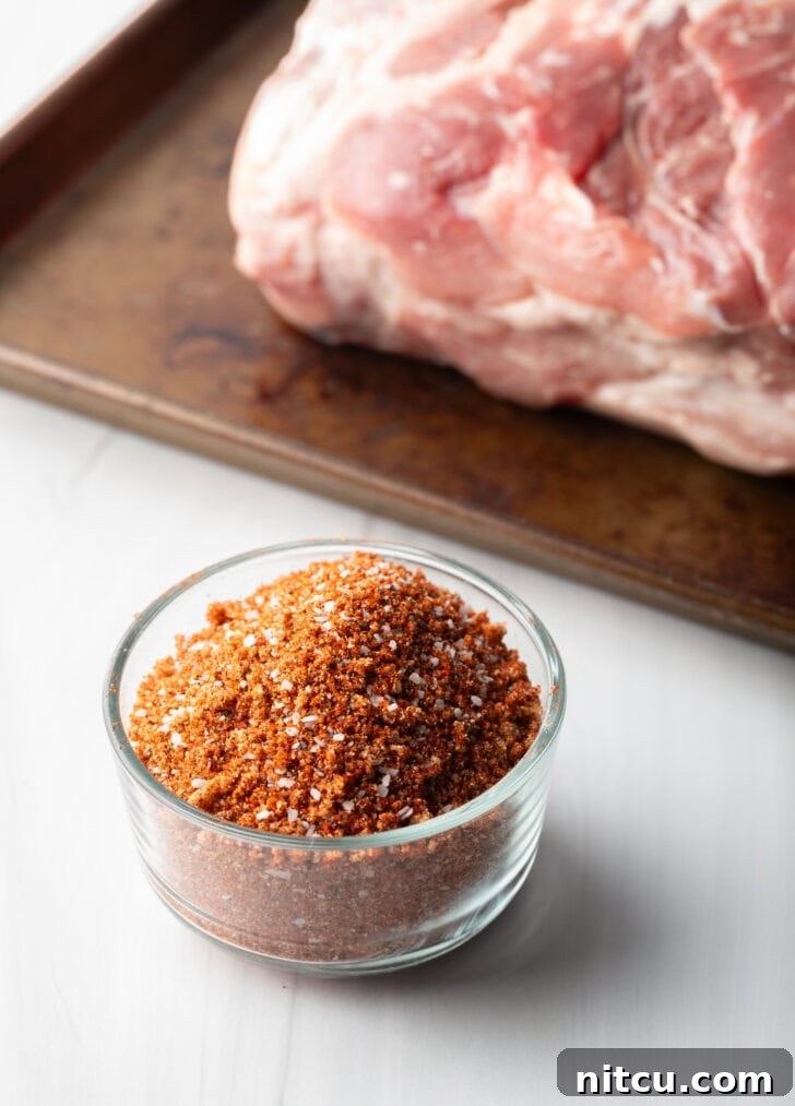 Another angle of the vibrant dry spice rub, showcasing the rich colors of brown sugar, smoked paprika, and other seasonings.