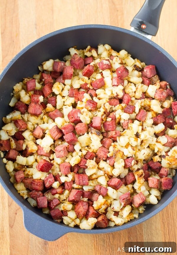Detailed steps showing how to perfectly prepare Corned Beef Hash for a delicious meal.