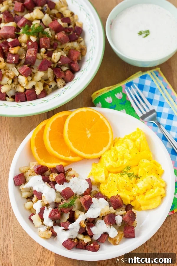Beautifully plated Corned Beef Hash, garnished with fresh herbs and horseradish cream sauce.
