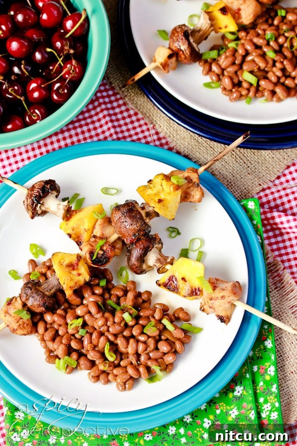 Close-up of grilled Kung Pao Chicken Skewers showcasing tender chicken, mushrooms, and pineapple