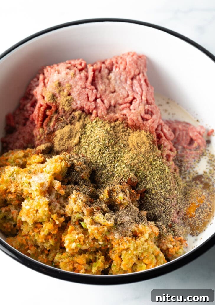 Close-up of the well-mixed meatloaf mixture in a bowl, showing its smooth and consistent texture before shaping.