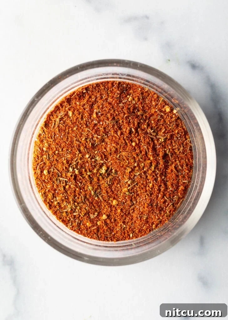 Blackening seasoning in a glass circular dish.