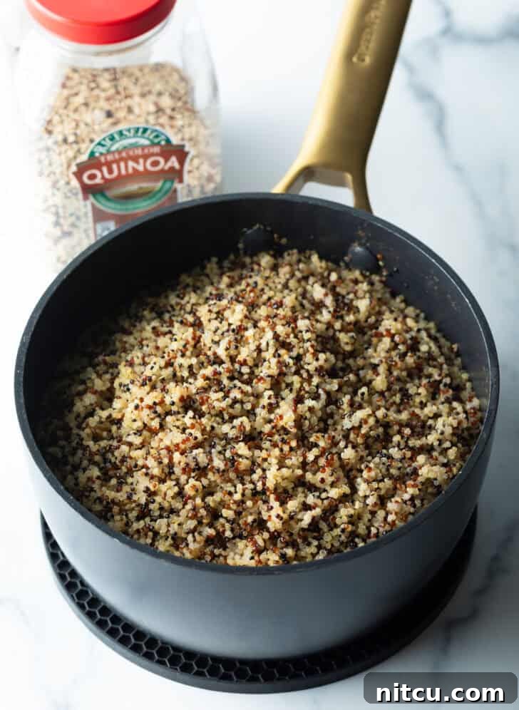 Cooked grains in a large black pot.