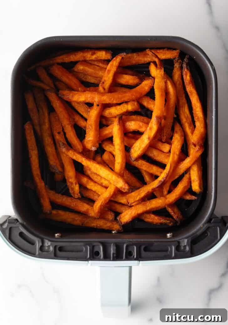 Sweet potato fries in an air fryer.