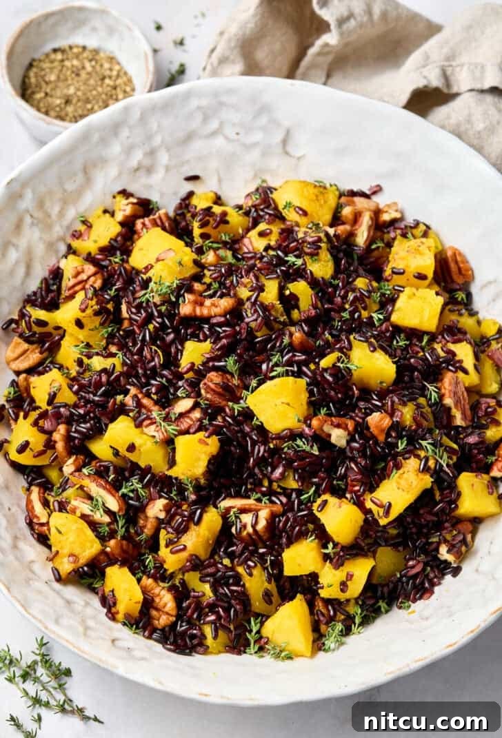 Black Rice Recipe (Forbidden Rice) in large bowl, garnished with herbs.
