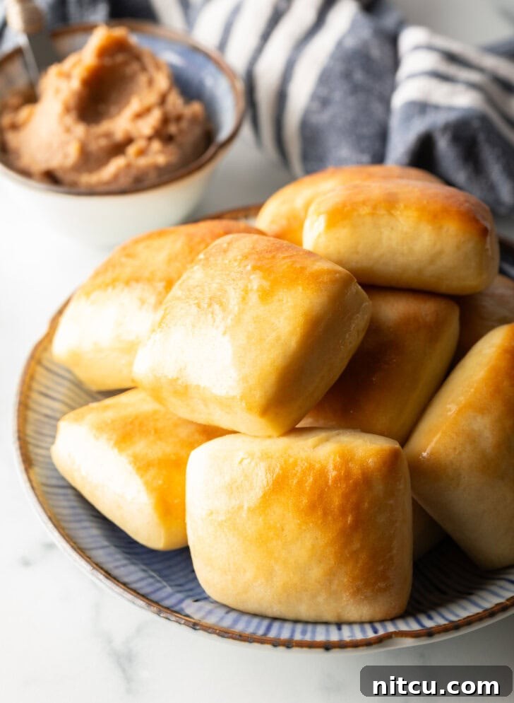 Stack of rectangle Texas Roadhouse rolls.