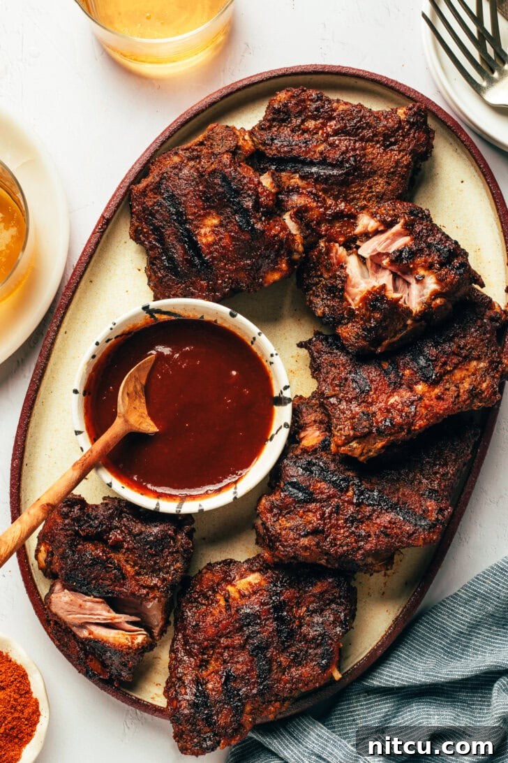 Generous platter of baby back ribs with homemade coffee BBQ sauce
