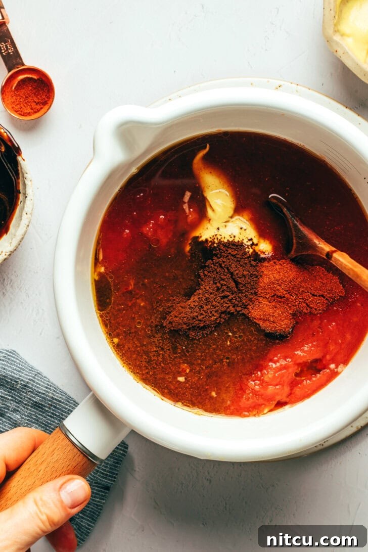 Chef preparing homemade coffee barbecue sauce in a saucepan