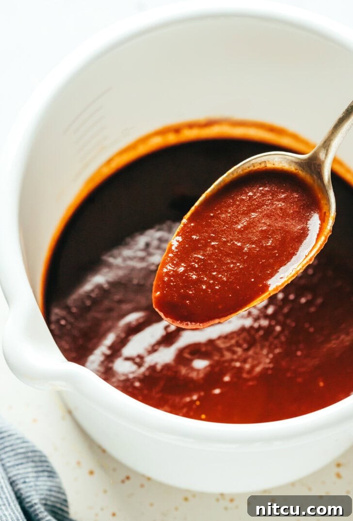 Rich, homemade coffee barbecue sauce simmering in a saucepan