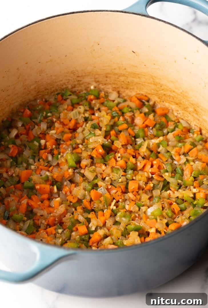 Large pot with chopped sauteed veggies.