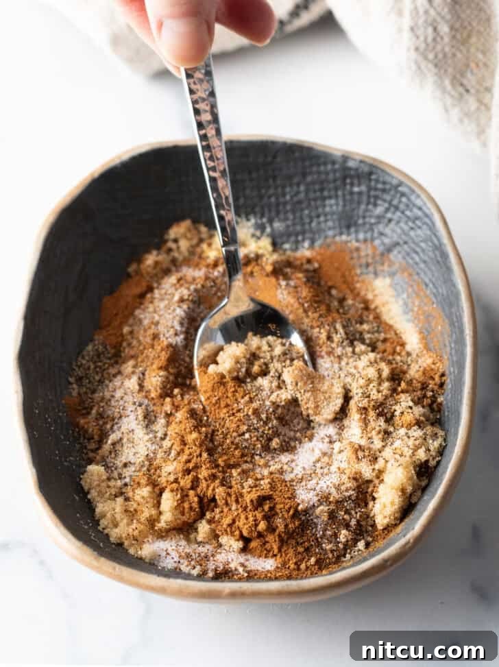 Close-up of chili powder and other spices in a bowl.