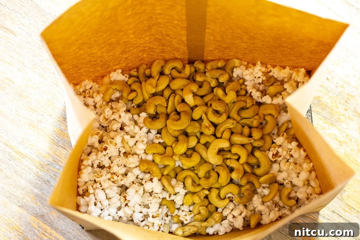 A close-up shot of freshly made homemade caramel corn, prepared in the microwave, showcasing its irresistible crisp coating.