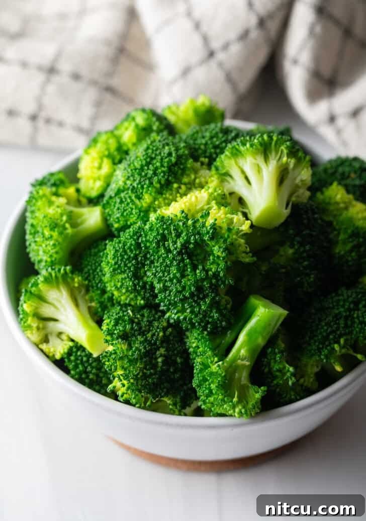 Cooked broccoli on the stovetop, vibrant green and ready to serve