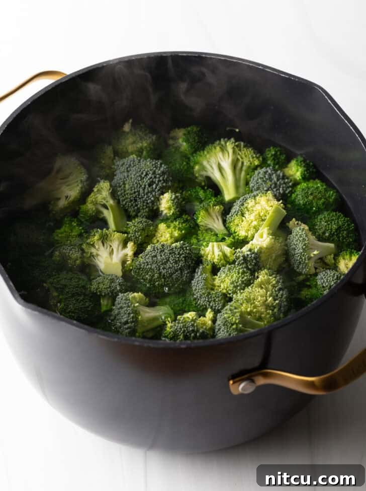 adding broccoli to boiling water