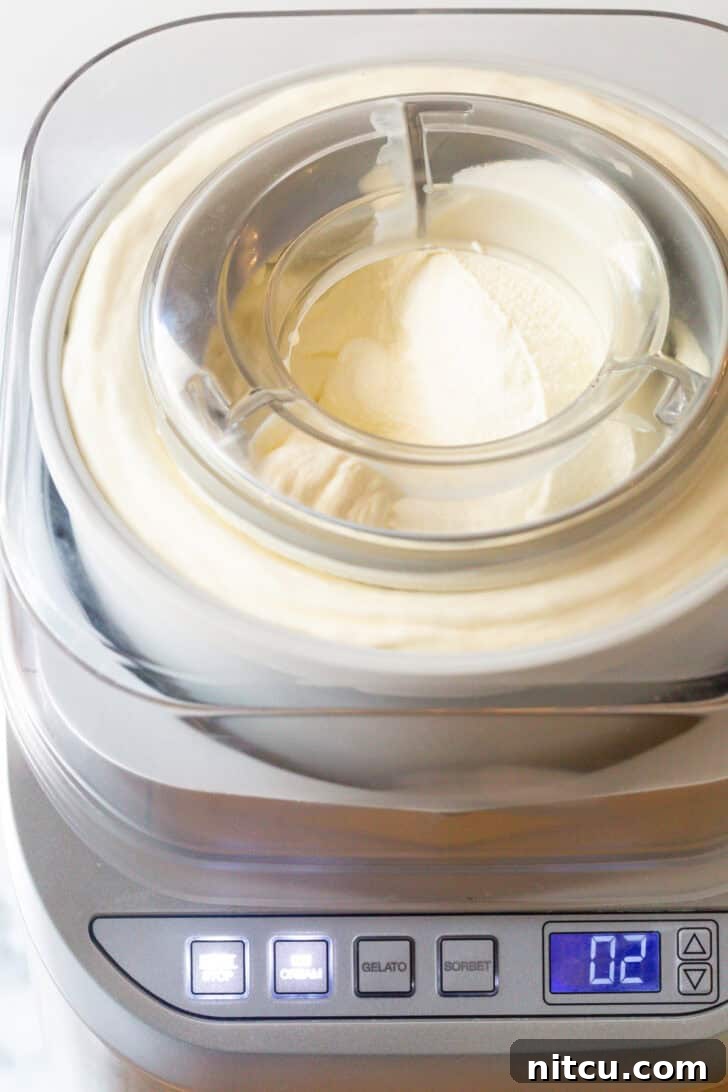 Churning ice cream in an electric ice cream machine.