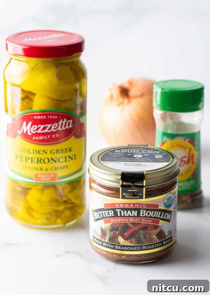 Recipe ingredients: Jar of beef bullion, jar of pickled pepperonicini, Italian seasoning, and whole onion.