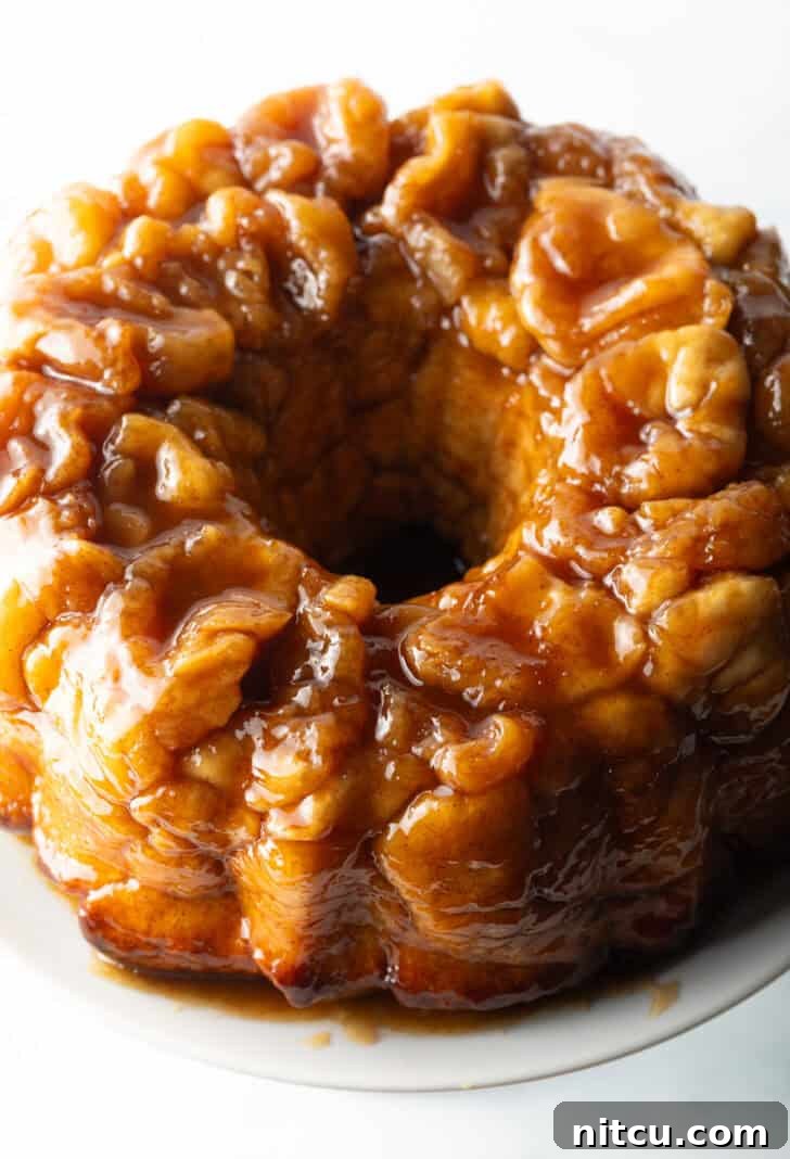 Top down view baked bundt monkey bread with bourbon syrup.