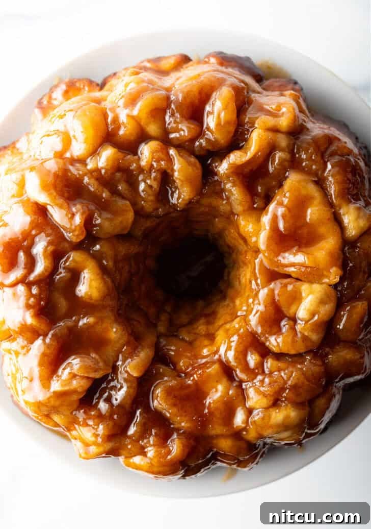 Top down view baked bundt monkey bread with bourbon syrup.