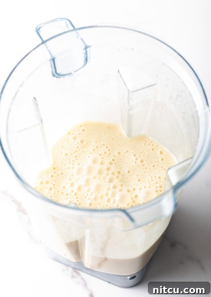Blender filled with smooth, light Dutch Baby batter, ready to be poured.
