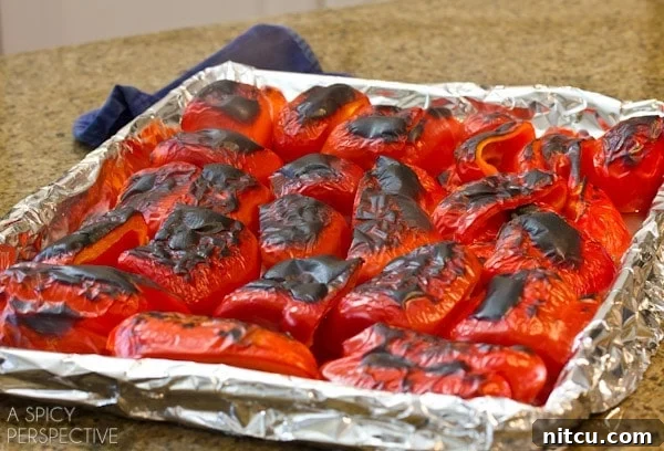 Oven Roasting Peppers | ASpicyPerspective.com #howto #diy #redpeppers