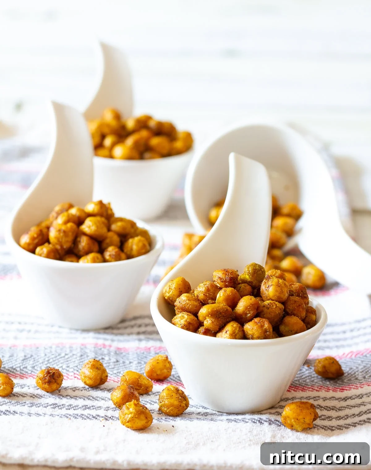 Spicy Roasted Chickpeas Recipe - a bold and crunchy snack that is waistline-friendly, vegan, and healthy.