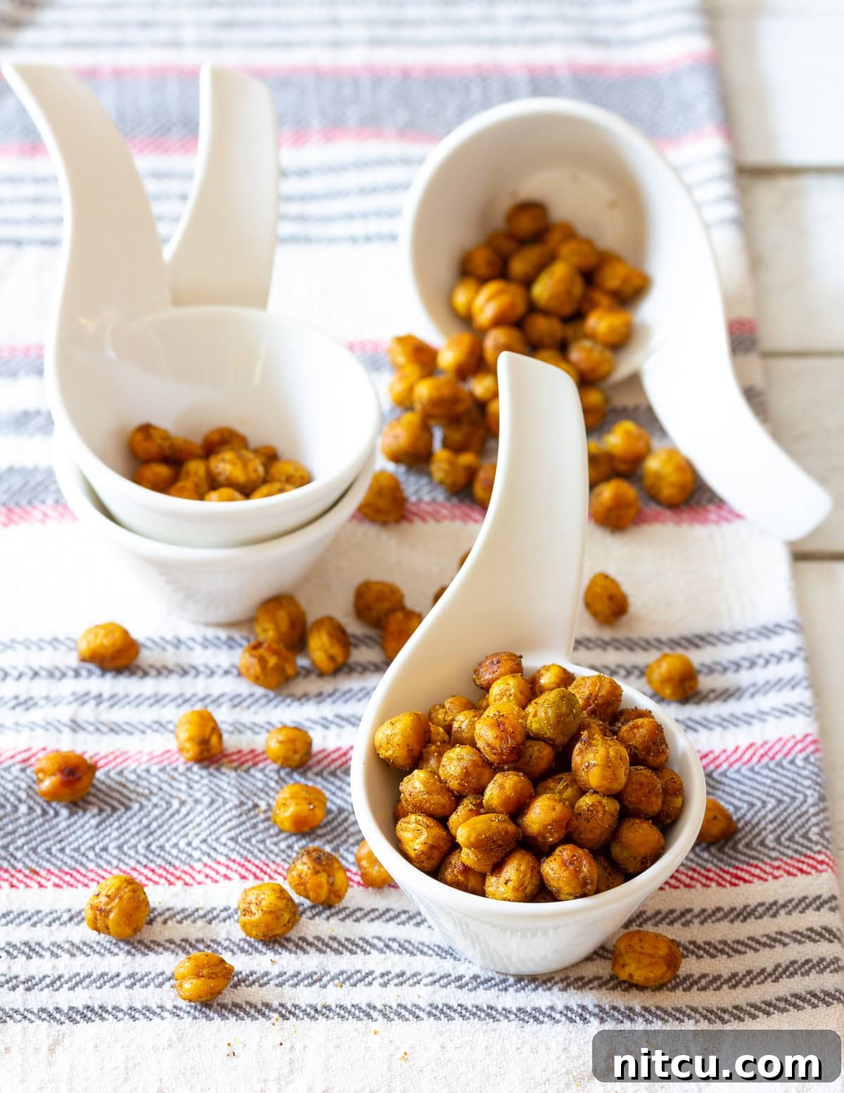 A bowl of flavorful roasted garbanzo beans, perfectly spiced for a healthy treat.