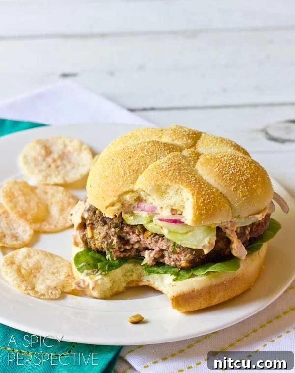 A close-up shot of two easy-to-make Mediterranean burgers, showcasing their fresh ingredients and appealing presentation.
