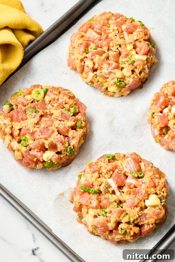 Healthy Ahi Tuna Burgers with Grilled Pineapple Recipe - formed patties neatly arranged on a tray before cooking