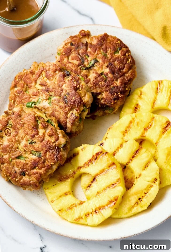 How to Make Tuna Burgers - a close-up of cooked Ahi Tuna patties and perfectly grilled pineapple slices, ready for assembly