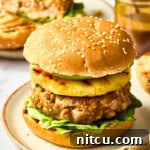 Ahi Tuna Burgers with Grilled Pineapple Recipe on plate, a vibrant and healthy meal idea