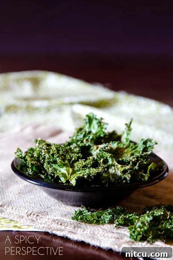 Baked kale chips in a small bowl.