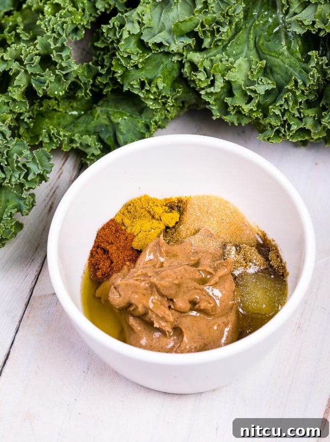 Spices and almond butter in a bowl.