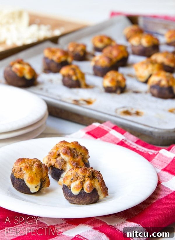 Easy Chorizo Stuffed Mushroom Recipe on plate with baking sheet in the background