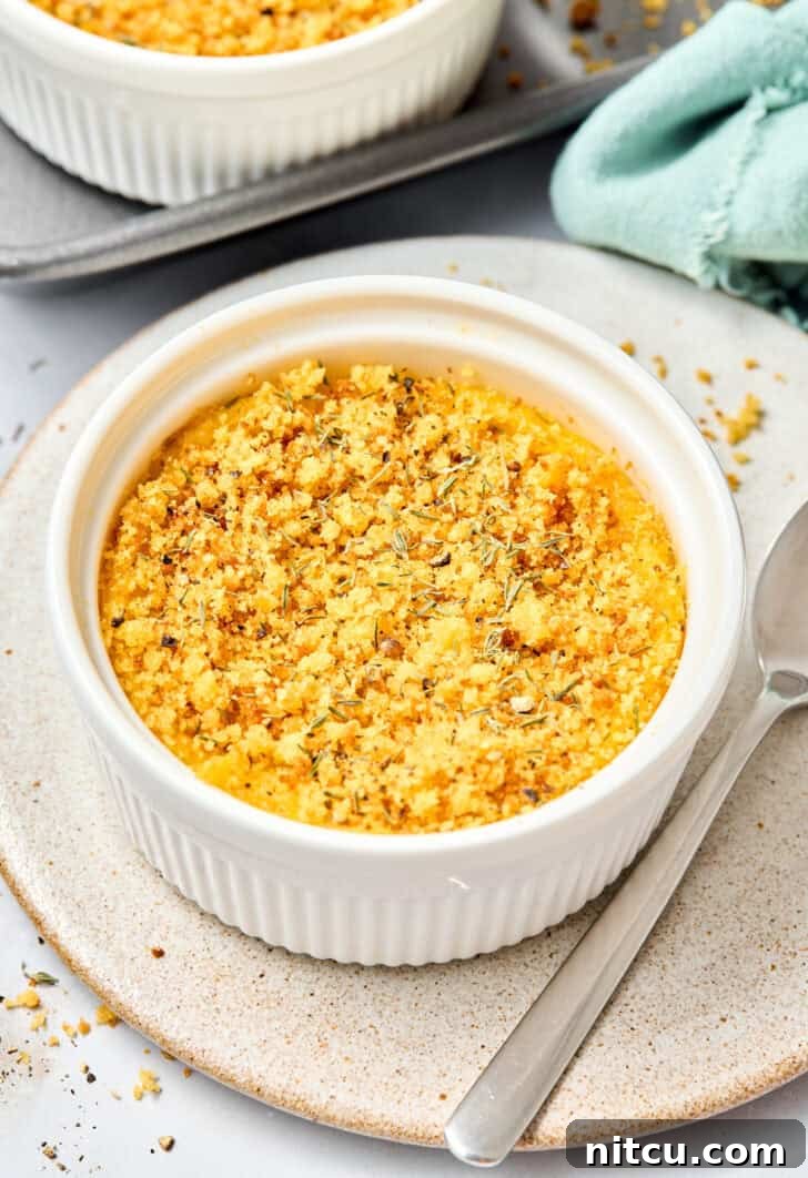 Golden brown squash casserole baked in a ramekin dish, ready to be served