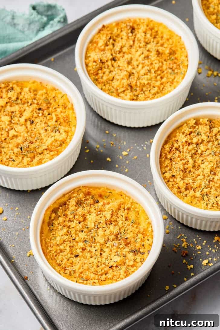 Squash Casserole baked in a large tray with a golden cornbread crumb topping
