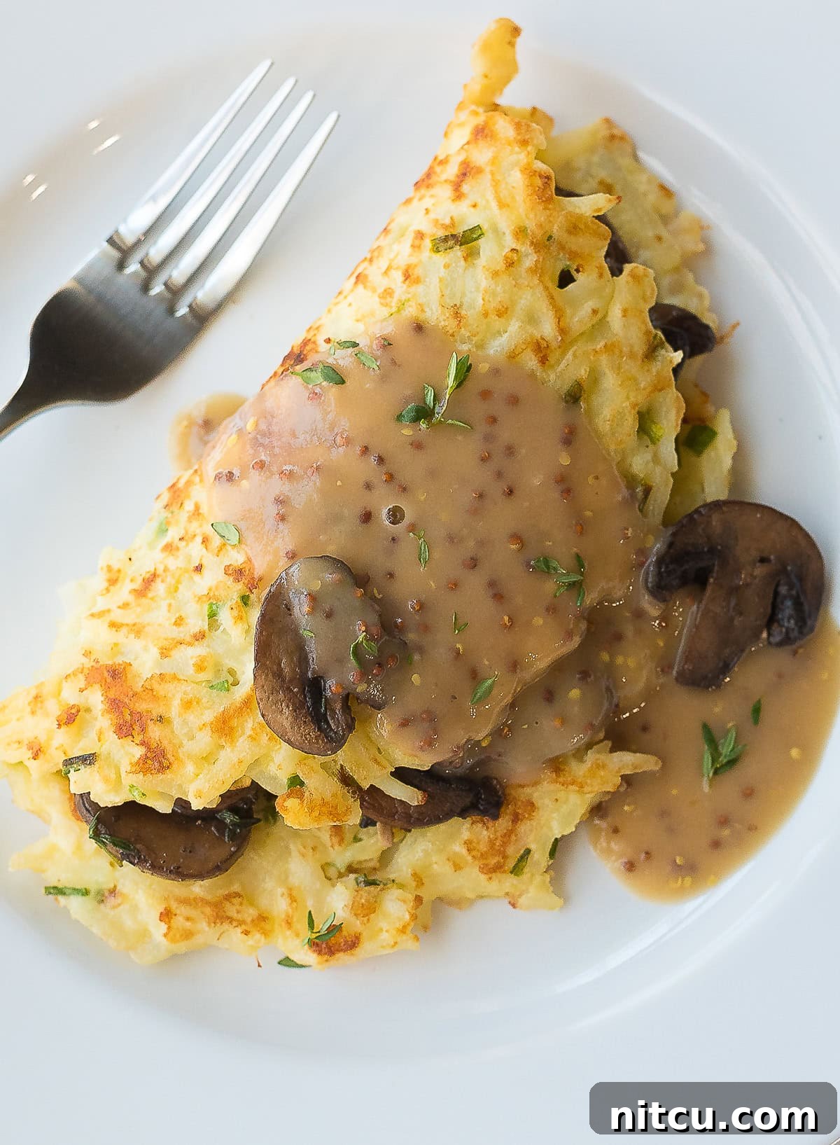Step-by-Step Guide to Making Irish Potato Pancakes with Earthy Mushrooms and Flavorful Whiskey Gravy