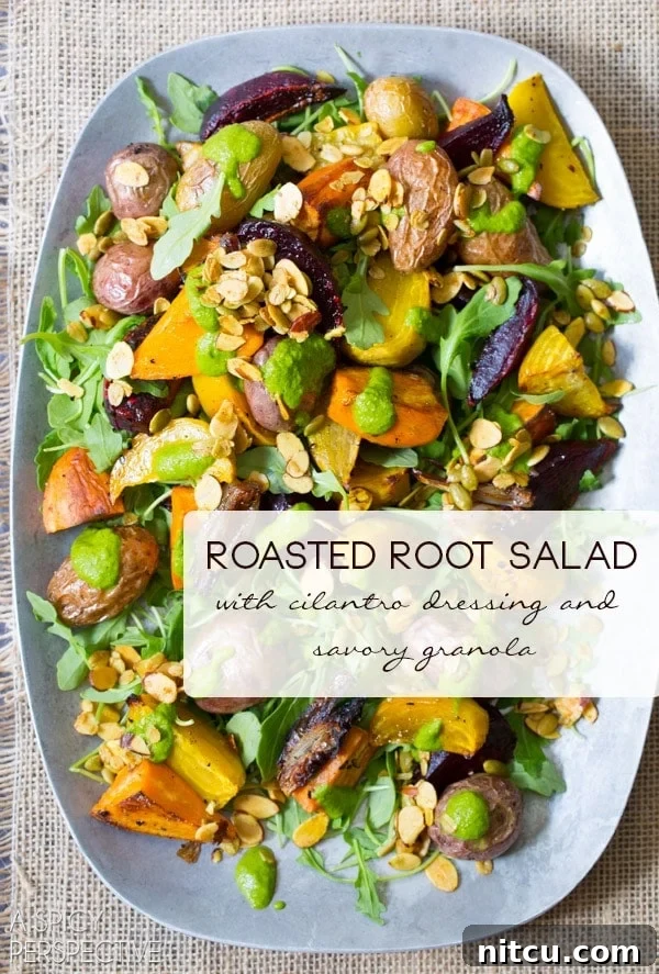 Roasted Root Vegetables Salad topped with granola and cilantro dressing on a serving platter.