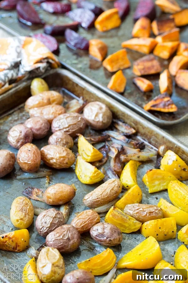 Roasted root vegetables on baking sheets.
