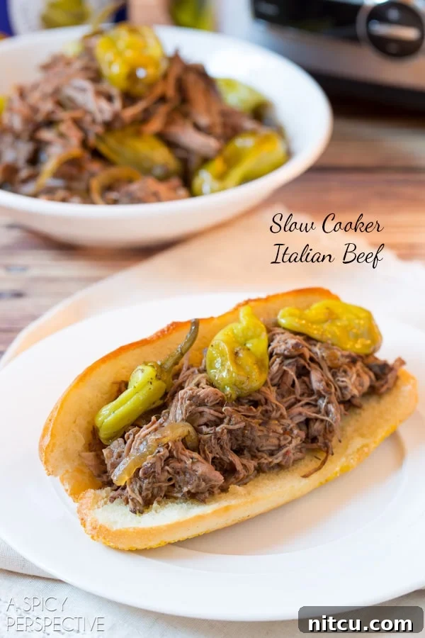 Italian Beef Recipe piled high in sub rolls, ready to be enjoyed as sandwiches