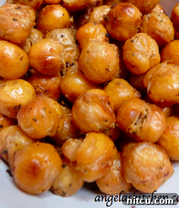 A close-up of beautifully roasted and seasoned crunchy chickpeas, ready to be enjoyed as a snack or topping.