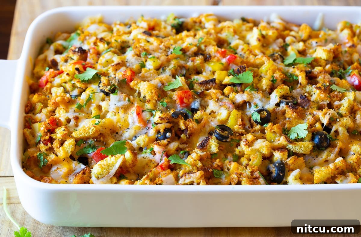 Mexican Thanksgiving stuffing after baking, showcasing a golden brown top and melted cheese