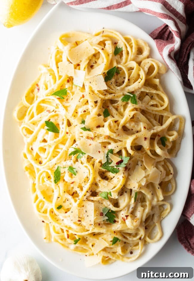 Homemade Fettuccine Alfredo recipe, an elegant Christmas pasta dish served in a bowl