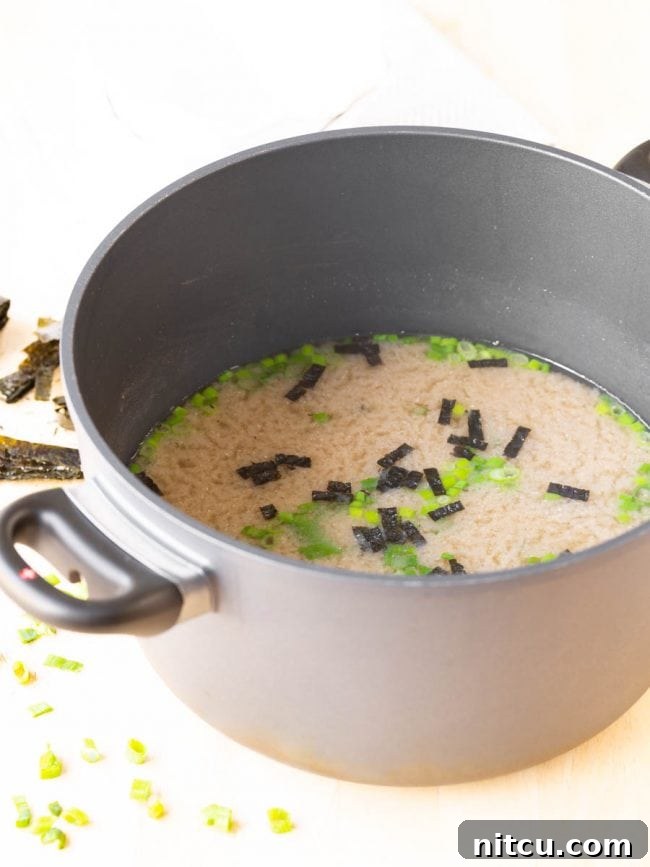 A whole pot filled with fresh, homemade miso soup, ready to be served.