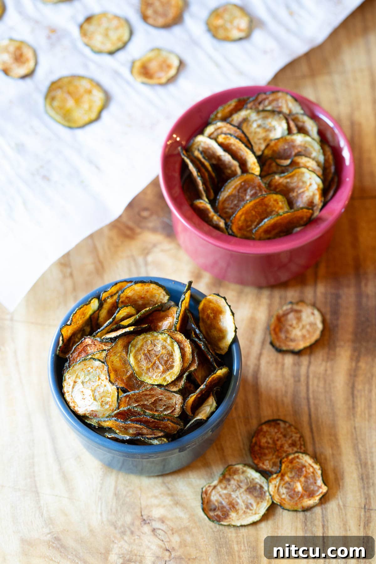 Baked Zucchini Chips - overhead shot of chips in two bowls